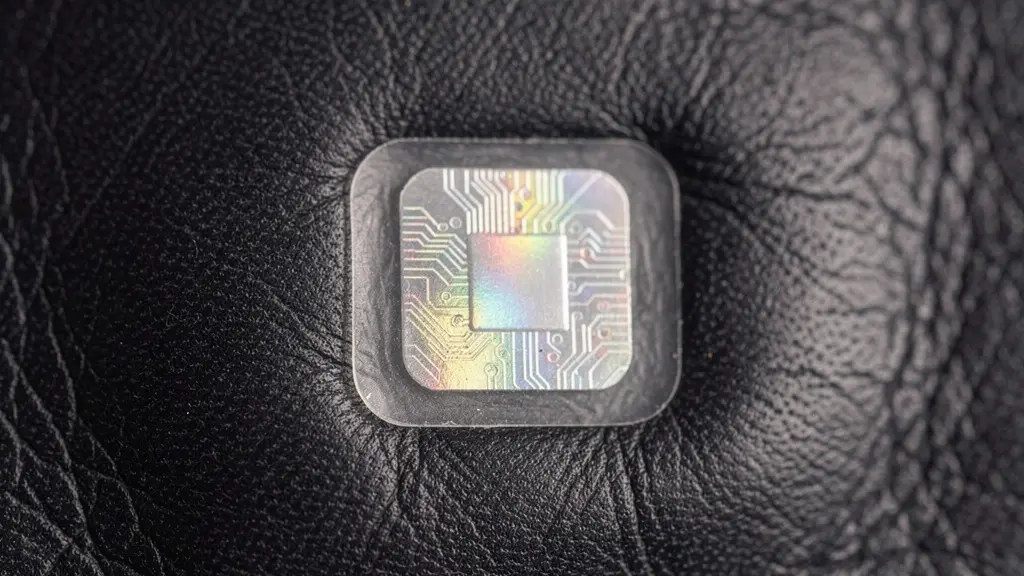 Macro shot of an NFC authentication tag embedded within the material of a luxury British product.